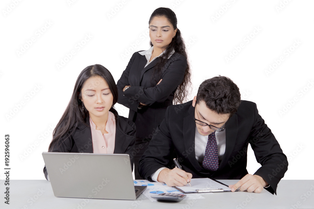 Indian business manager watch over her staff Indian business manager watch over her staff