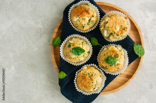 Freshly baked cheesy spinach bread on a white stone backdrop. Rustic style.