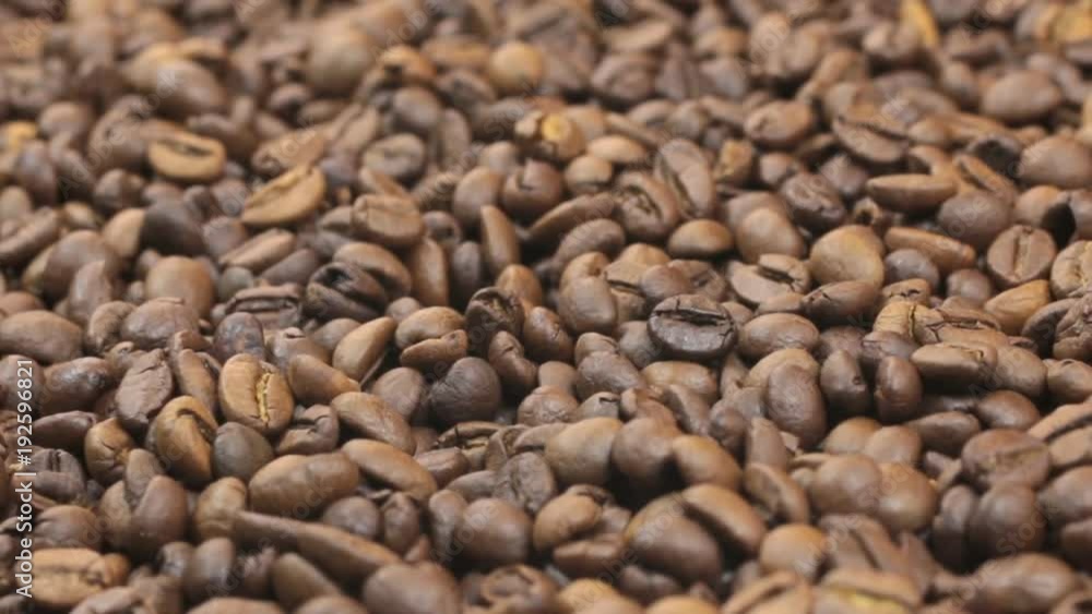 Rotation of the background of whole beans of coffee. Close-up Rotation of the background of whole beans of coffee. Close-up