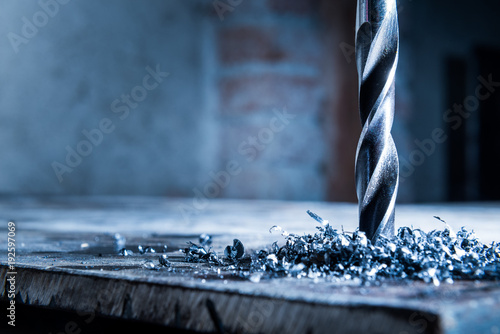 close up of a drill with metal shavings photo