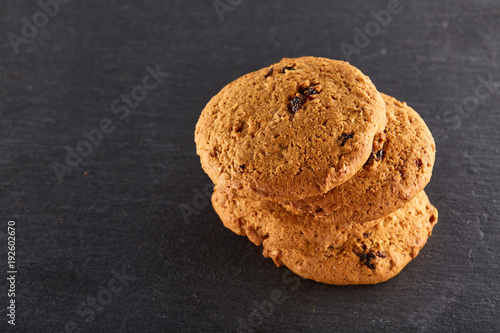 Chocolate chips cookies isolated on black background, macro, close-up, shallow depth of field