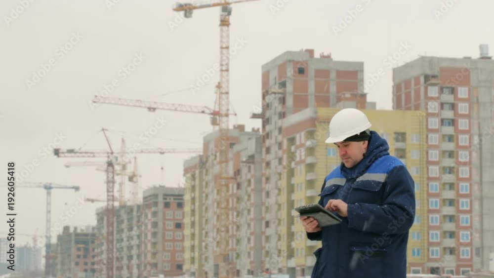 Foreman with pad at major construction project Foreman with pad at major construction project