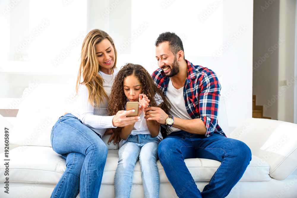 Young family sitting on the couch