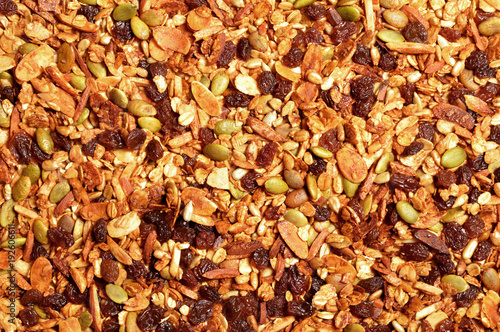 Granola texture, muesli texture, a top view close photo image on granola or muesli pile present a detail in top view of granola or muesli texture, a cereal grain healthy food, can use for background