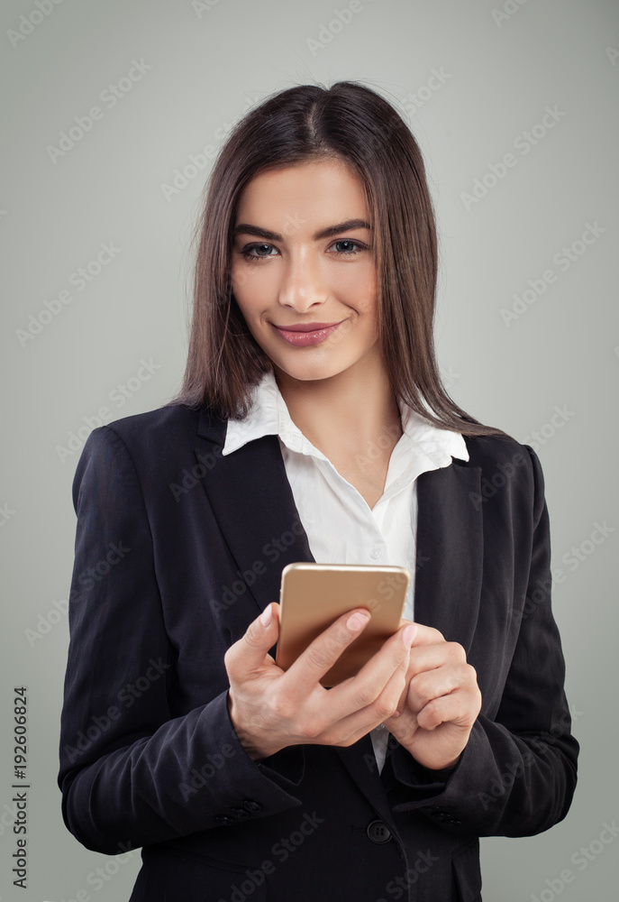 Smiling young businesswoman texting coworker. Business woman cell phone Smiling young businesswoman texting coworker. Business woman cell phone