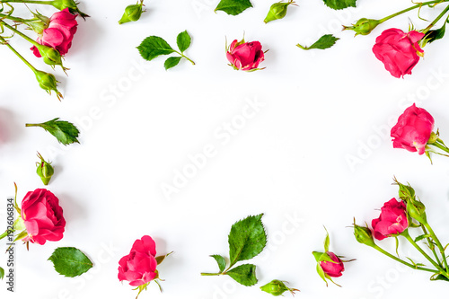 berry color decorative cosmetics with roses white background top