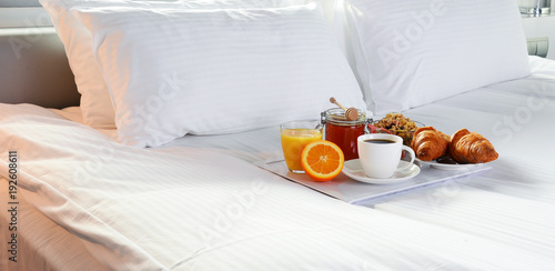Quadro su tela Breakfast in bed in hotel room.