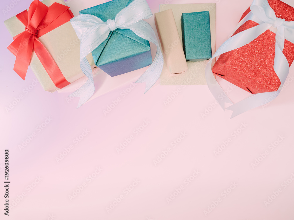 greeting and celebration for christmas , birthday or new year with group of wrapping gift box and pink pastel background