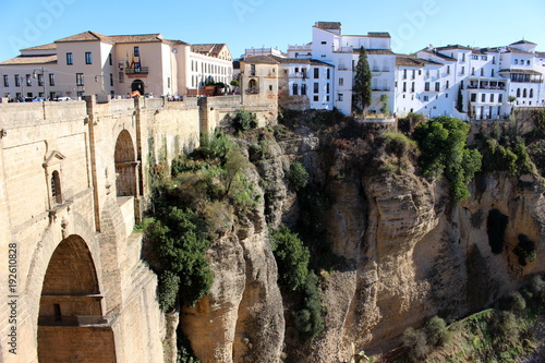 Beautiful view of the canyon (El Tajo gorge), the white houses and the Puente Nuevo bridge/ Ronda, Andalucia, Spain