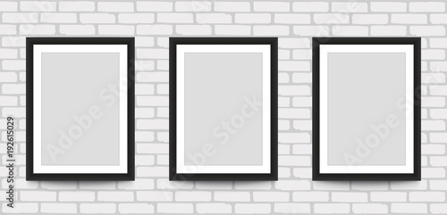 Blank picture frame for photographs on the brick wall. Stock vector