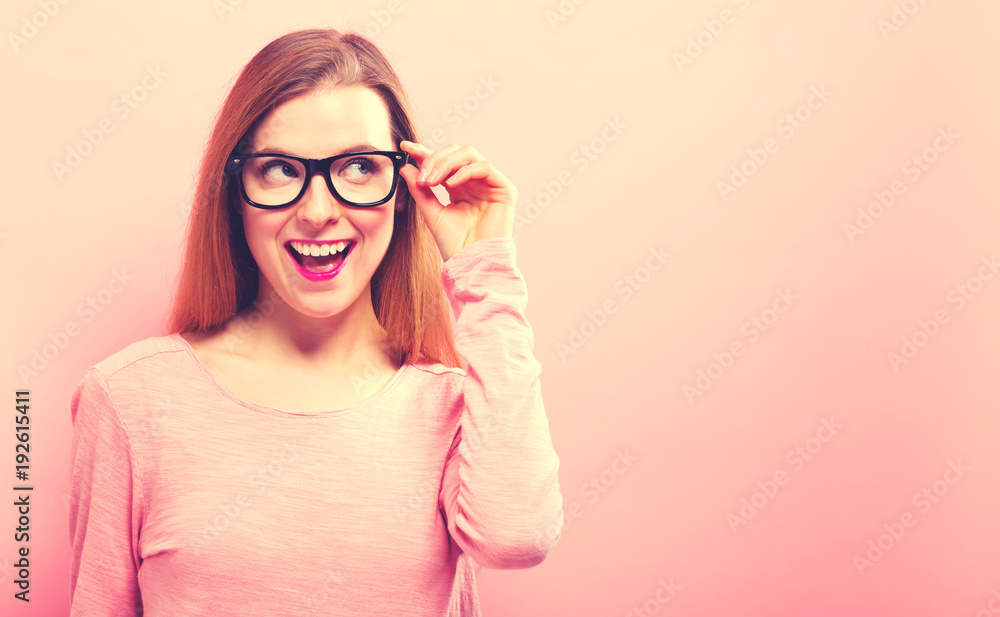 Young businesswoman in a thoughtful pose on a solid background Young businesswoman in a thoughtful pose on a solid background