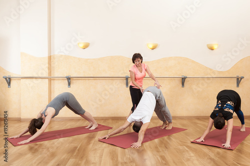 a group of people doing yoga photo