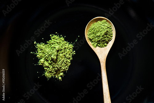 Matcha green tea on black background