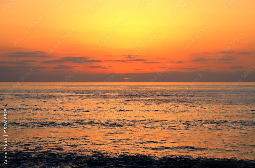 The Sunset over the Pacific Ocean from Ocean Beach near San Diego, California.