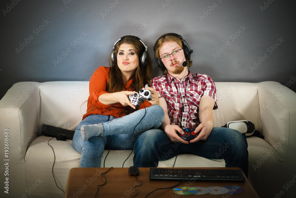 Gaming couple playing games Gaming couple playing games