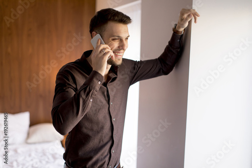 Young man with mobile phone...