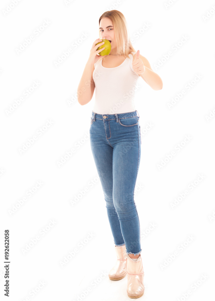 Pretty young girl with green apple, studio Pretty young girl with green apple, studio