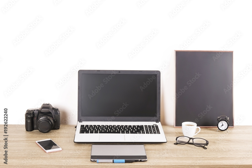 Photo blogger / photographer / it specialist's typical office space table with laptop, blank screen, coffee cup and electronics. Top view, copy space, flat lay, overhead, backdrop. Photo blogger / photographer / it specialist's typical office space table with laptop, blank screen, coffee cup and electronics. Top view, copy space, flat lay, overhead, backdrop.