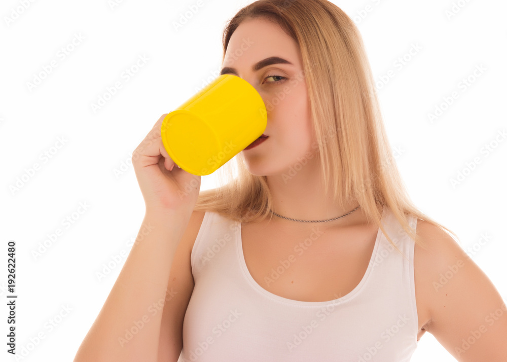 Young cute woman drinks coffee or tea, studio Young cute woman drinks coffee or tea, studio