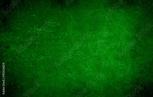Dark green background of school blackboard colored vignetted texture. Dark green black shabby texture.