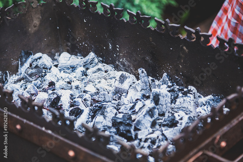 Fotografie Hot coals in metal brazier closeup