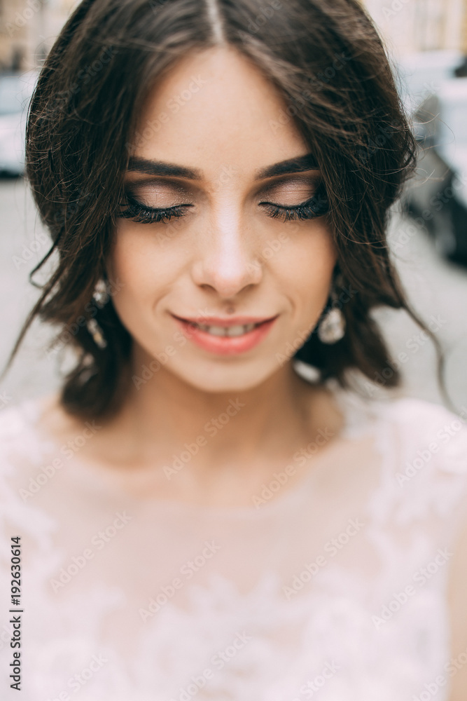 A large portrait of the bride's face. A large portrait of the bride's face.