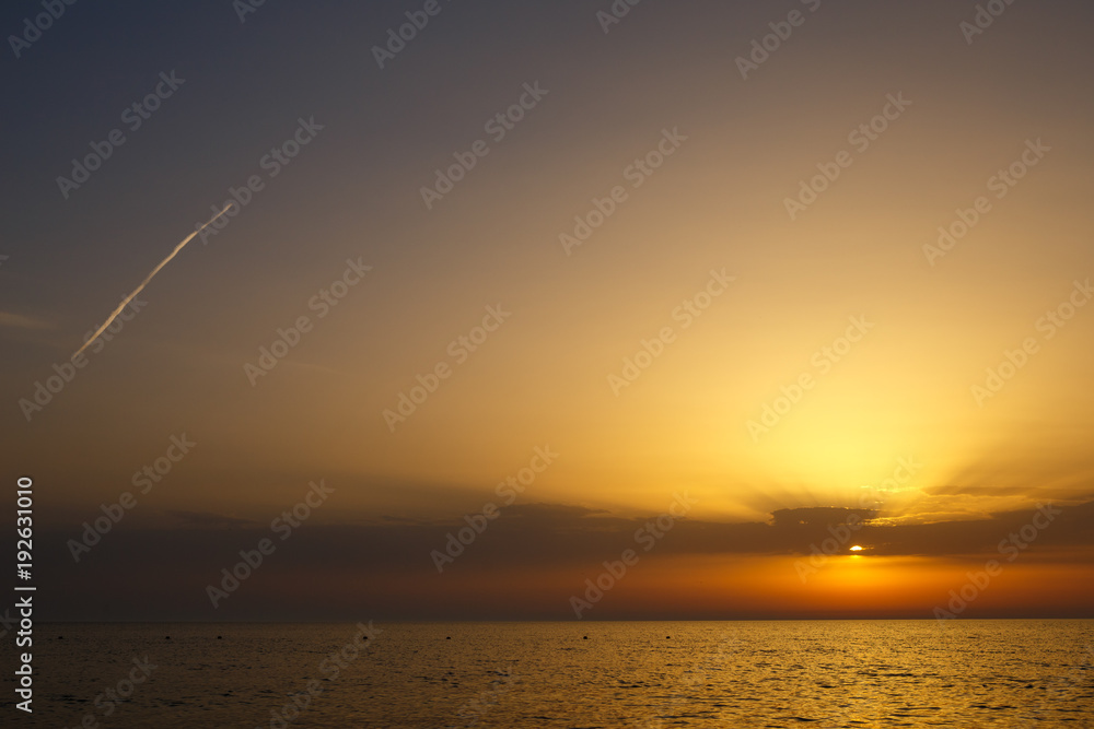 beautiful clouds at sunset. sunset over the sea.Sunset / sunrise with clouds, light rays and other atmospheric effect. sunset over the sea, calm . the concept of tranquility. rest and travel