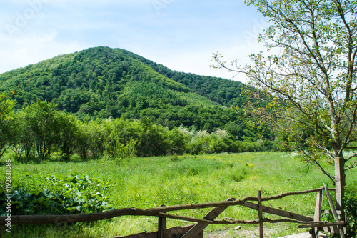 Wooden fence and field of Cisnadie countryside in Romania