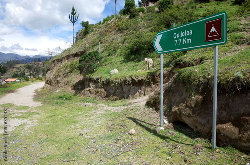 A sign marks the way of the Quilotoa Loop hike in the Ecuadorian Andes
