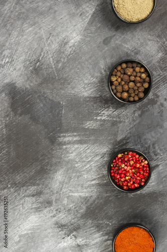 Fototapeta Naklejka Na Ścianę i Meble -  Various pepper on a black background. Top view, copy space. Food background