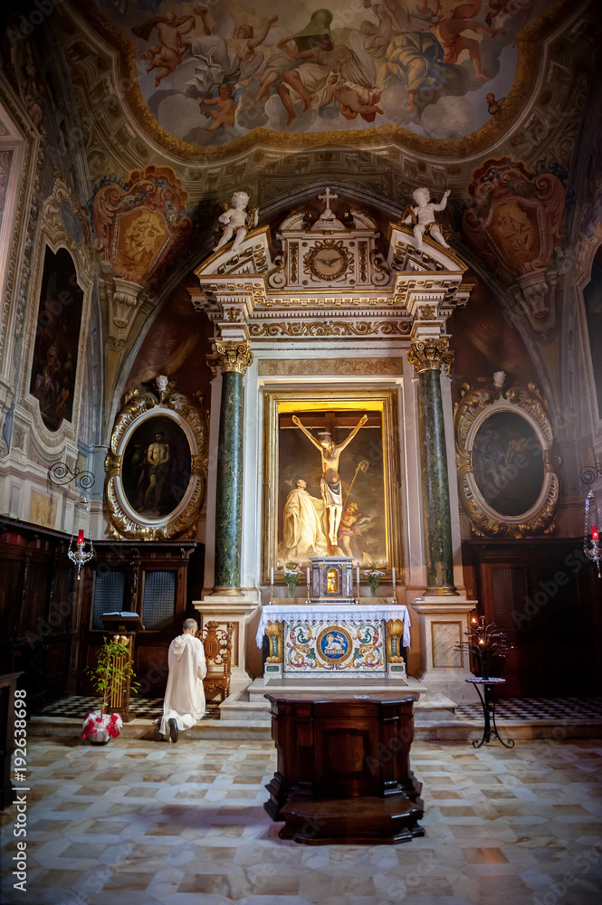The Baroque interior and frescoes of the Abbey of Monte Oliveto Maggiore is a large Benedictine monastery in the Italian region of Tuscany, near Siena.