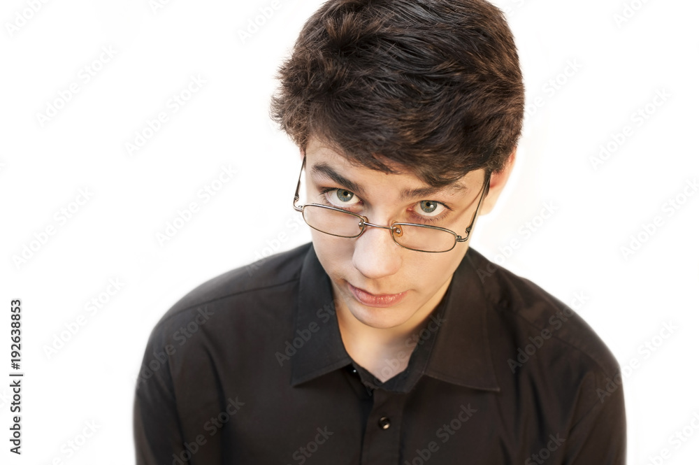 Guy in glasses to improve his vision on a white background. Horizontal. He looks at the top. Top view Guy in glasses to improve his vision on a white background. Horizontal. He looks at the top. Top view