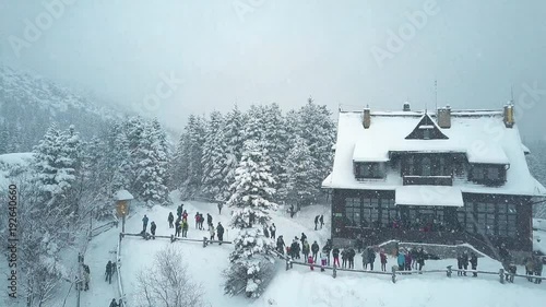 Aerial view of tourists and mountain chalet by the Morskie Oko or Sea Eye lake in southern Poland