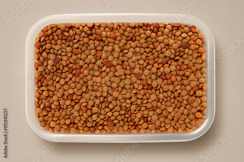 Whole Grains. Top View of Healthy grain foods in a White bowl on grey background with Real Shadow.