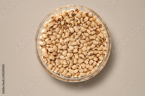 Whole Grains. Top View of Healthy grain foods in a Glass bowl on grey background with Real Shadow.