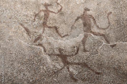 images of ancient people on the wall of the cave. history. archeology.