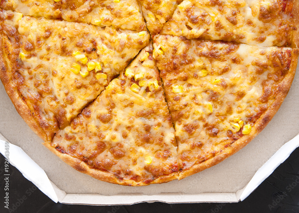 Pizza with ingredients on stone background
Pizza with ingredients on stone background