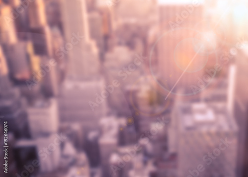 Sticker Defocused blur of buildings across New York City with sunflare effect
