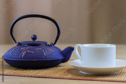 Blue Chinese cast iron teapot. Cooking utensils.