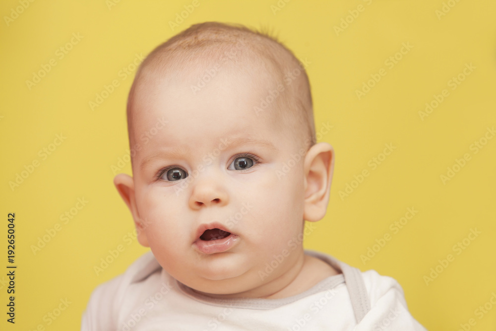 funny kid on a bright yellow background