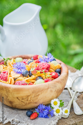Closeup of cornflakes with druits and flowers