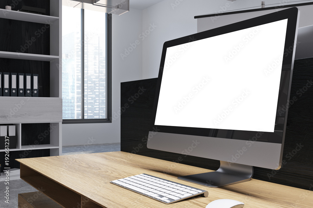 Fototapeta premium White desktop screen on table in office