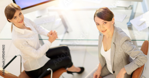 Wallpaper Mural view from the top rear.business woman with a colleague sitting at a Desk Torontodigital.ca