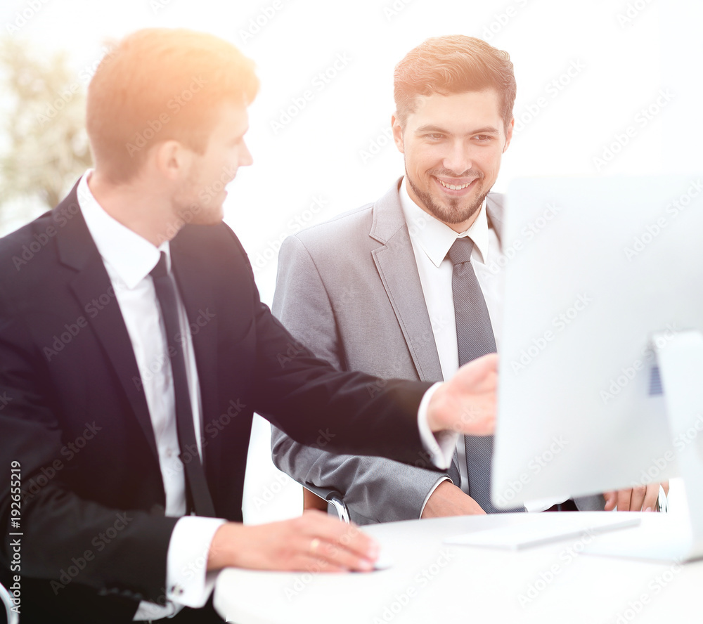 employees are talking sitting behind a Desk employees are talking sitting behind a Desk