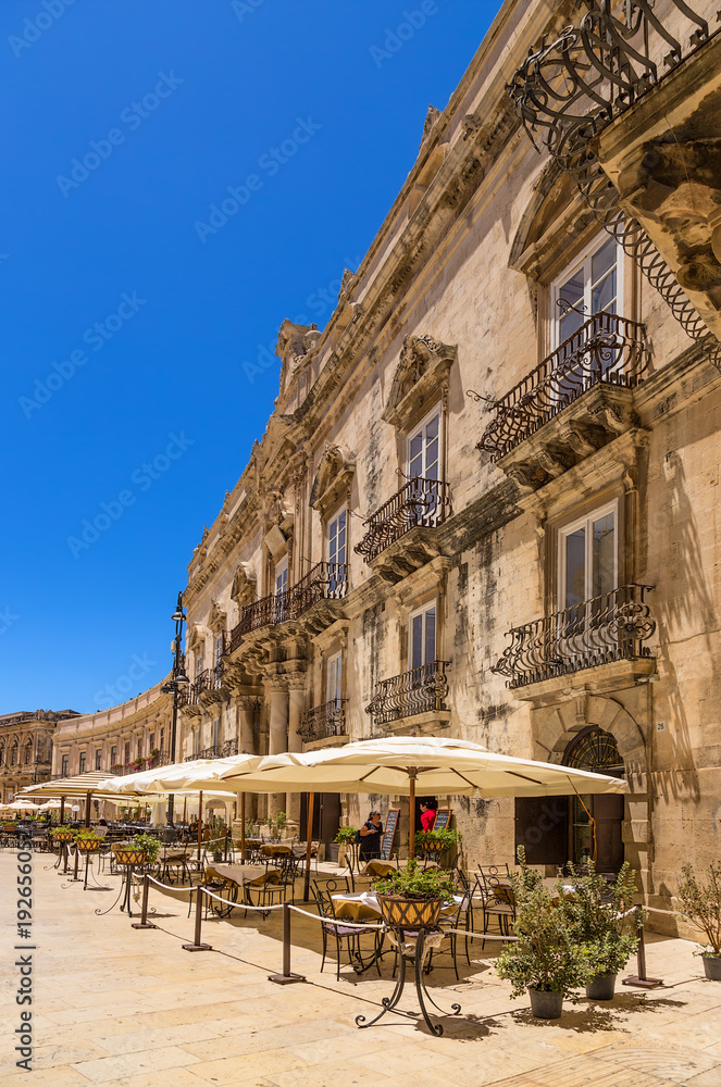 Fototapeta premium Syracuse, Italy. Baroque facade of the Palace of Benevento del Bosco on Cathedral Square on the island of Ortigia (wholly included in the UNESCO World Heritage List).