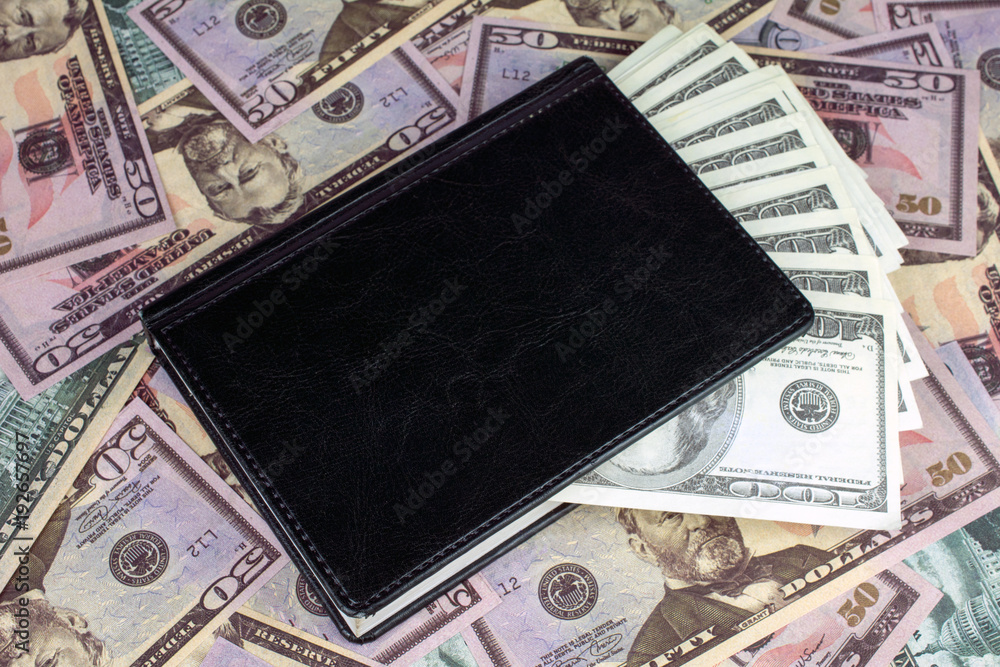 calculator green notebook with dollar bills on the background of money capital gains concept calculator green notebook with dollar bills on the background of money capital gains concept
