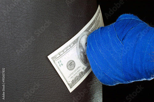 bandaged hands boxing pushes bag punch for money borrowed money concept black background selective focus photo