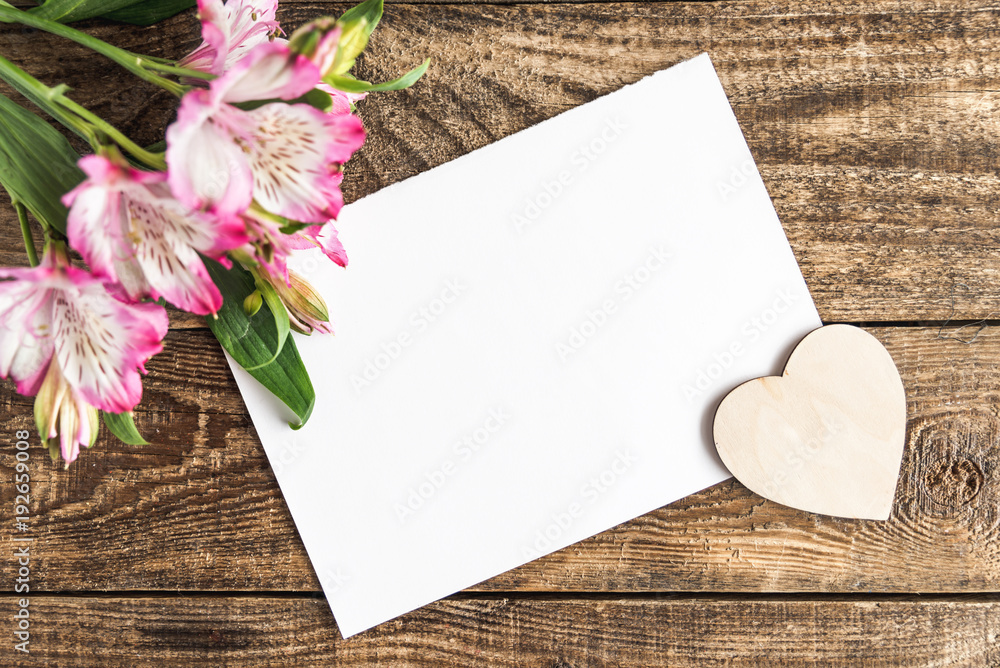 notebook with heart on wooden background notebook with heart on wooden background