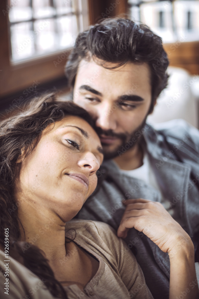 Young couple on the sofa in love Young couple on the sofa in love