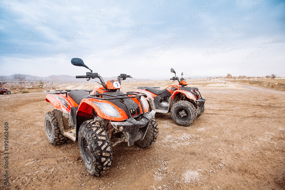 ATV Quad Bike in front of mountains landscape ATV Quad Bike in front of mountains landscape
